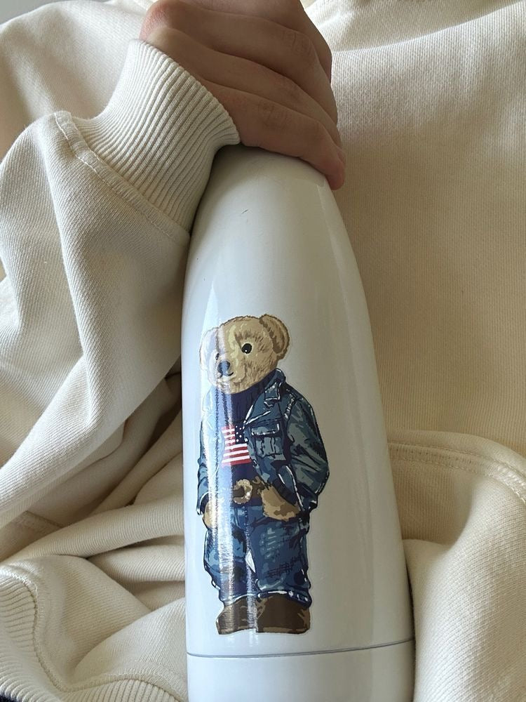 White stainless bottle with teddy bear graphic, screw-top lid
