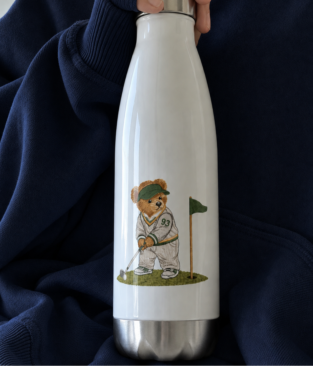 Stainless steel water bottle with white body and teddy bear golfer graphic