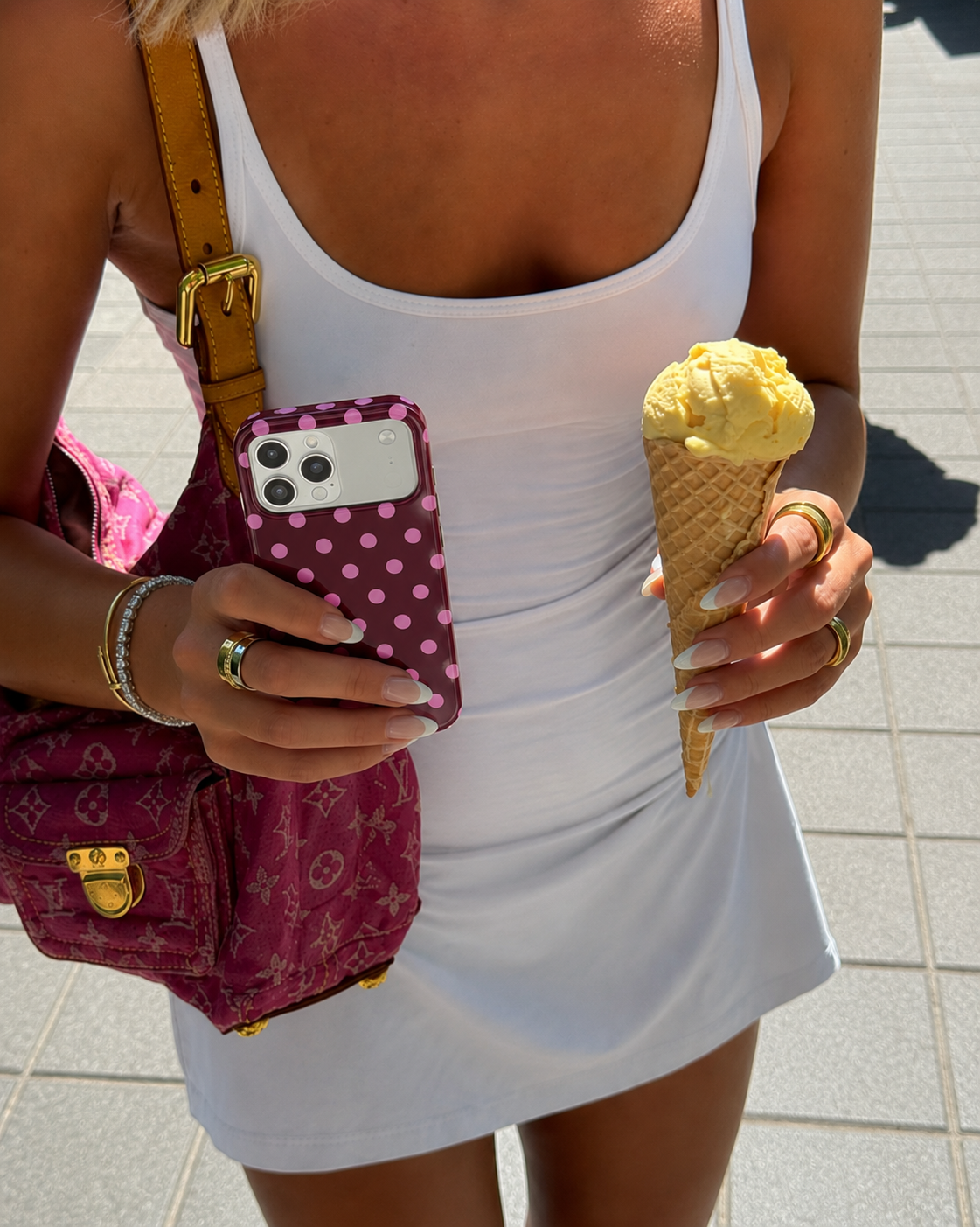 Raspberry pink polka dot phone case with camera cutouts