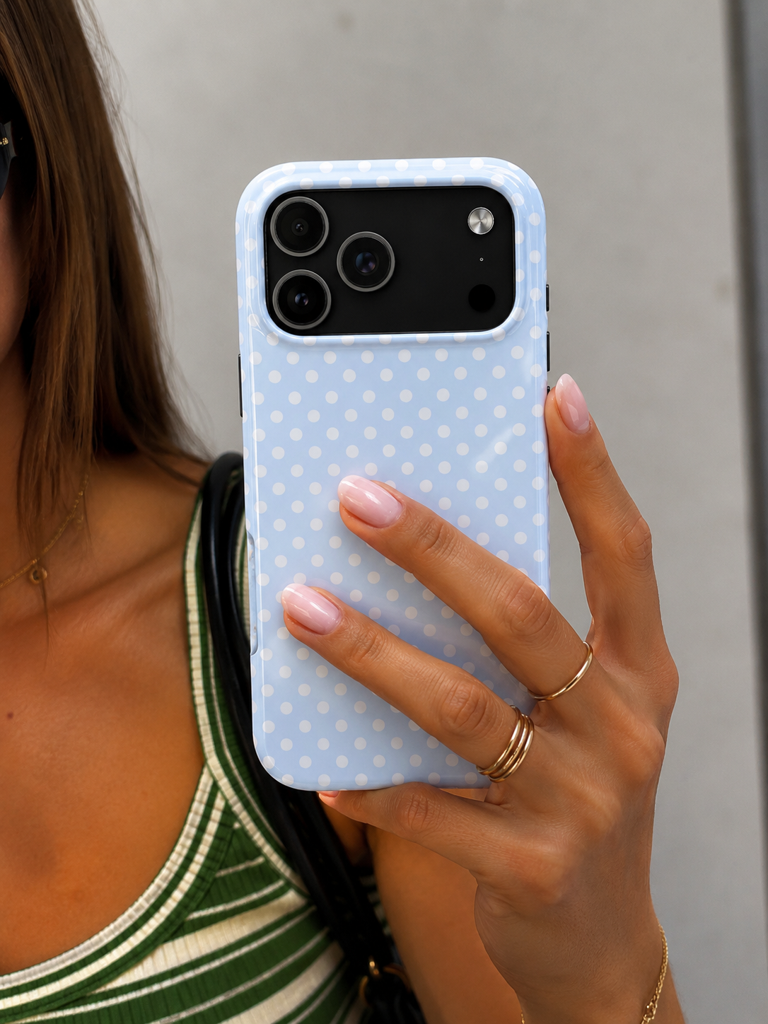 Light blue polka dot phone case with camera cutouts
