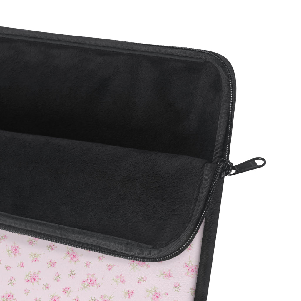 Neoprene laptop sleeve showing black interior padding and zippered edge