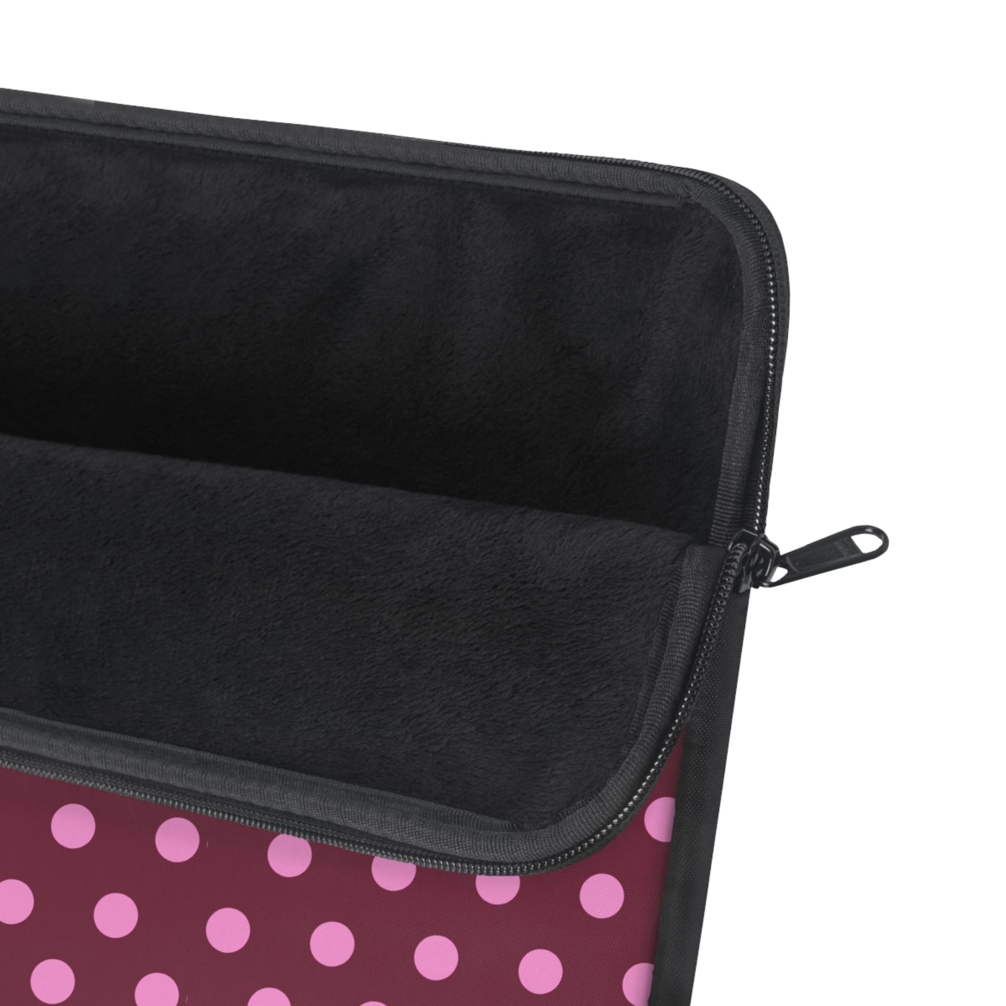 Polka dot neoprene sleeve corner with black interior and zip pull