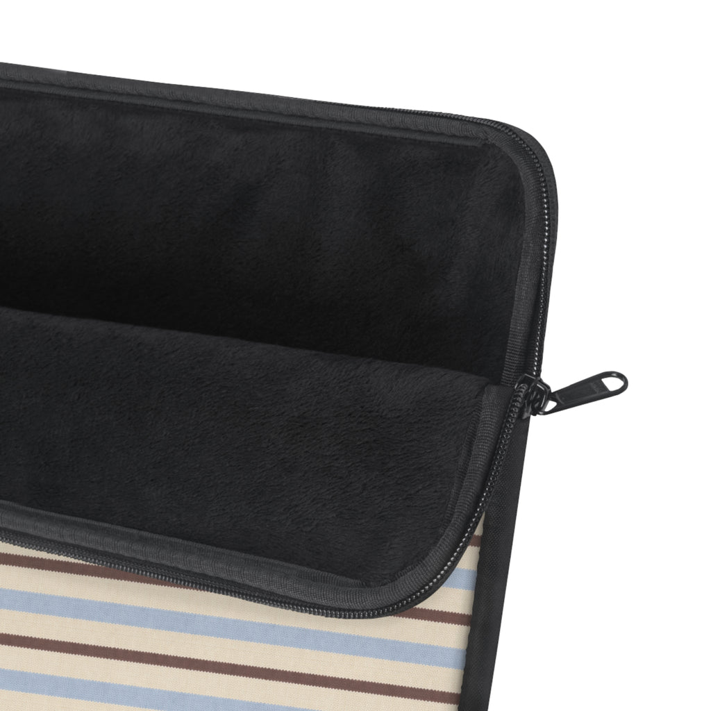 Striped laptop sleeve corner with black zipper, zipper pull, and dark interior lining