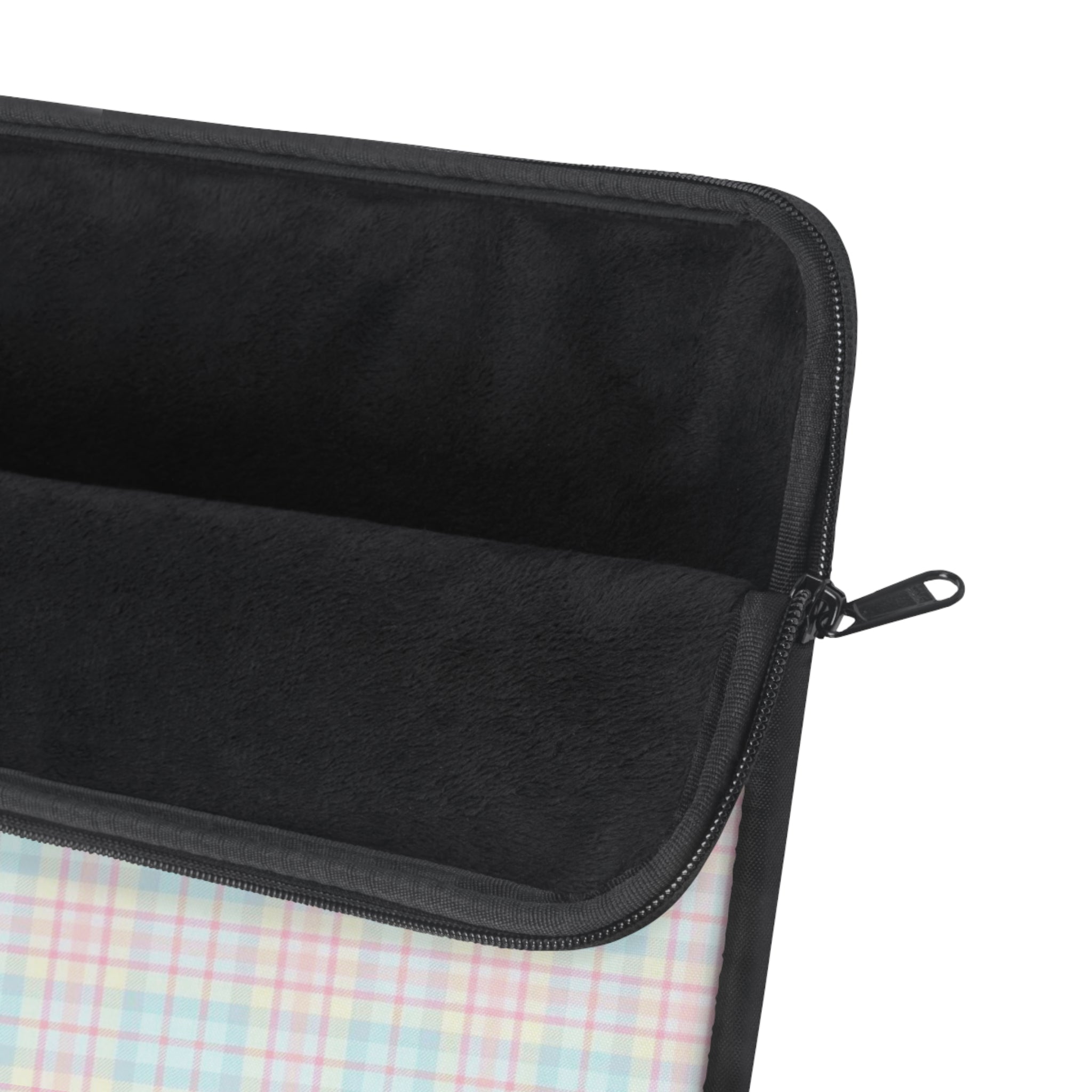 Black fabric device sleeve with zip closure and handle pull; plaid lining visible.