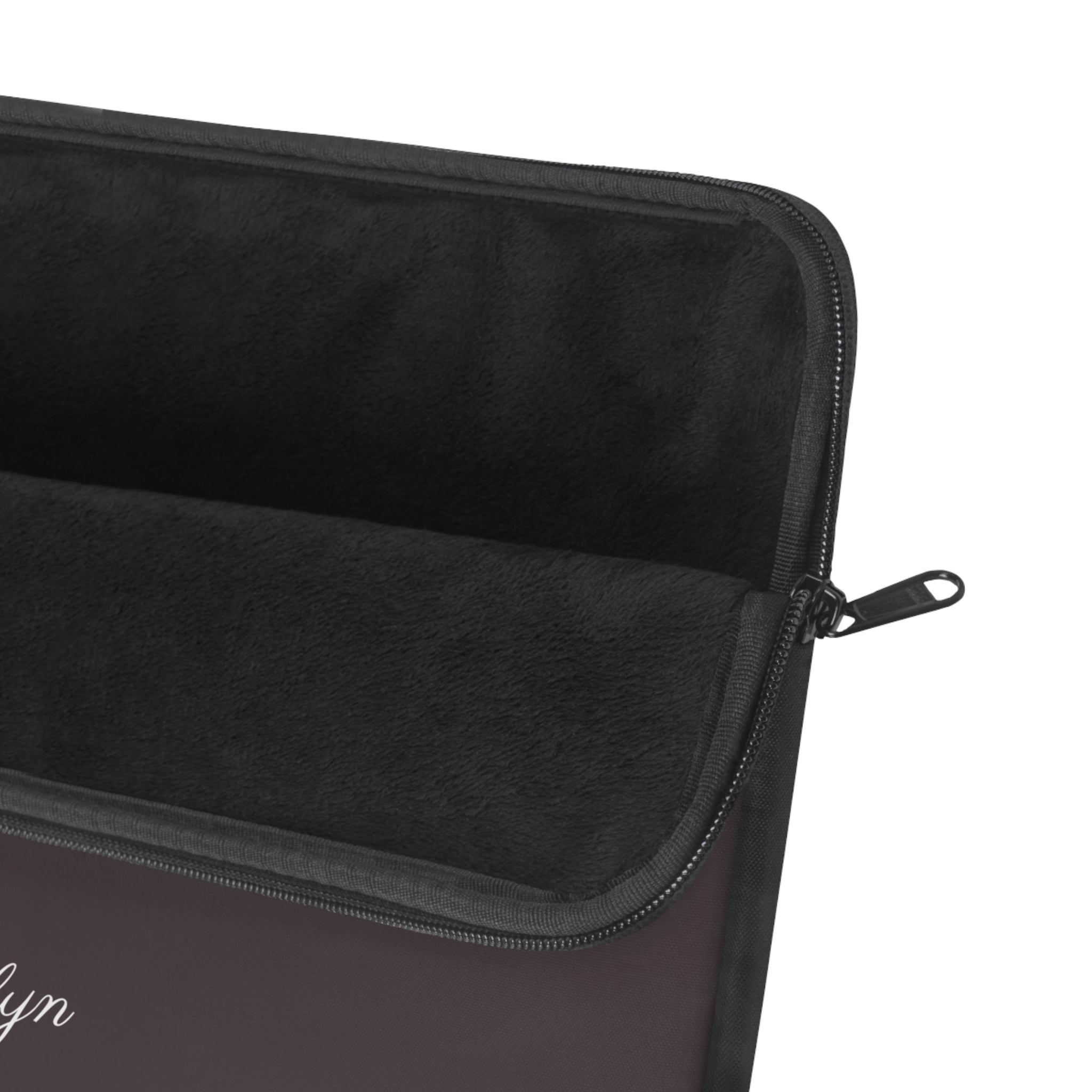 Dark plum laptop sleeve close-up with zipper track and stitched edge
