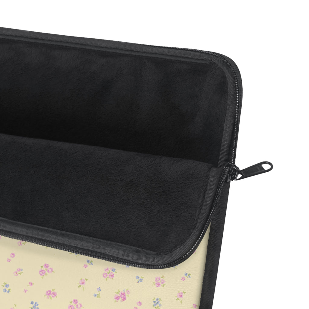Zippered laptop sleeve with black interior, padded edge, and visible zipper