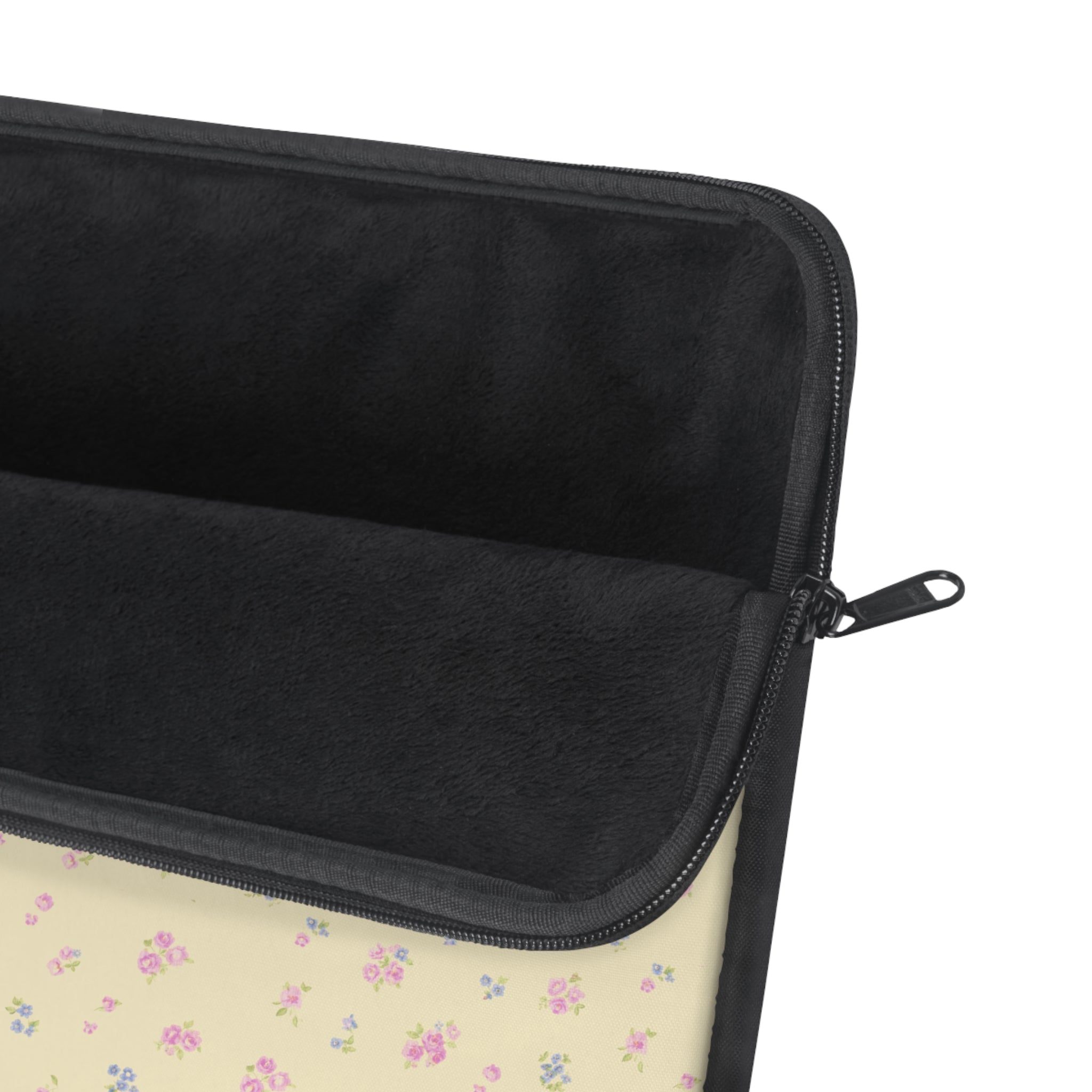 Zippered laptop sleeve with black interior, padded edge, and visible zipper