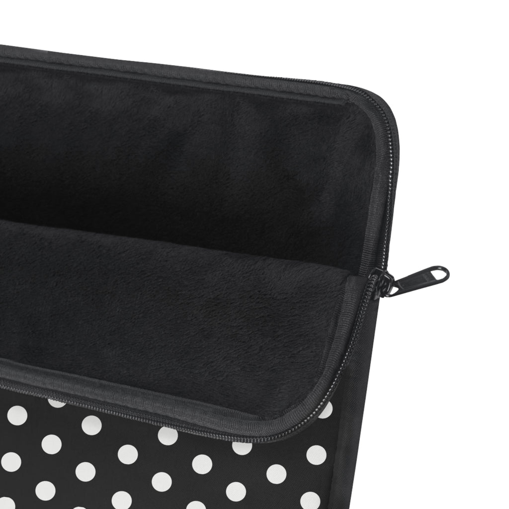 Black zippered device sleeve with white polka dots and smooth lining