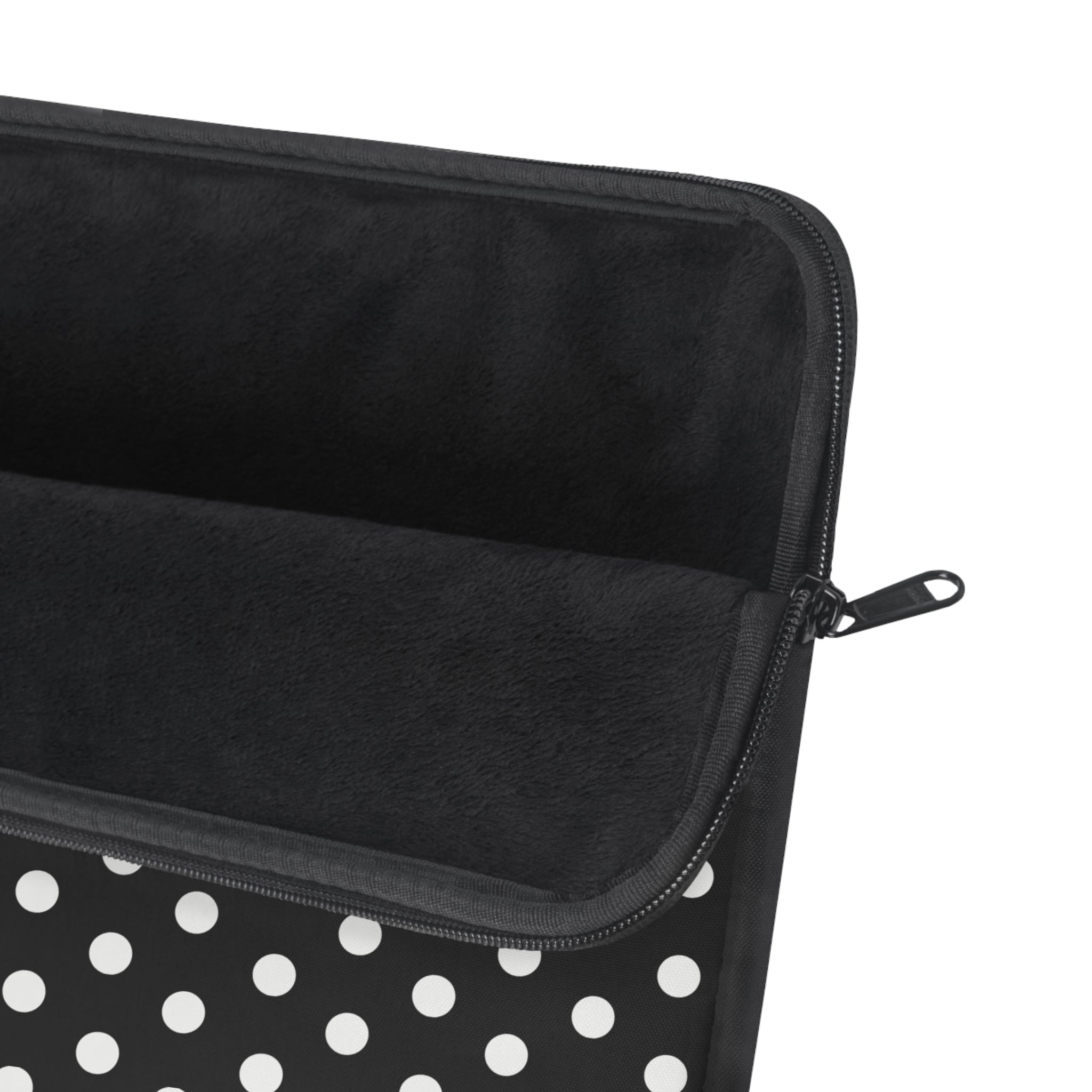 Black zippered device sleeve with white polka dots and smooth lining