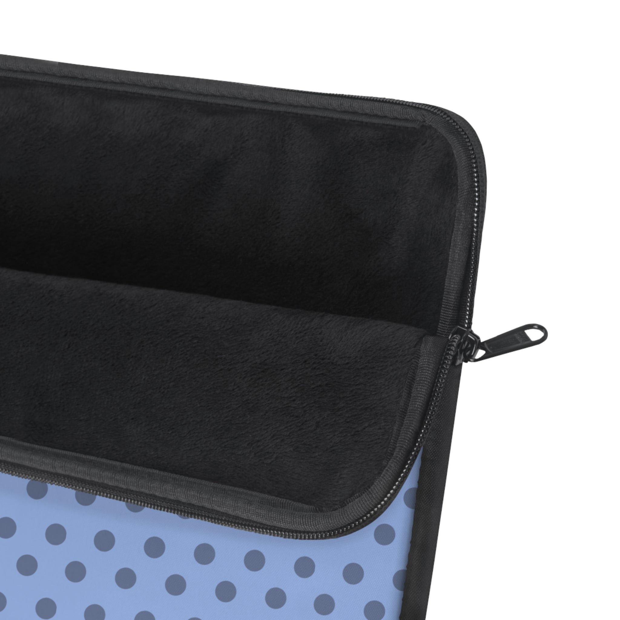 Zipped neoprene laptop sleeve with black interior and blue polka dot exterior