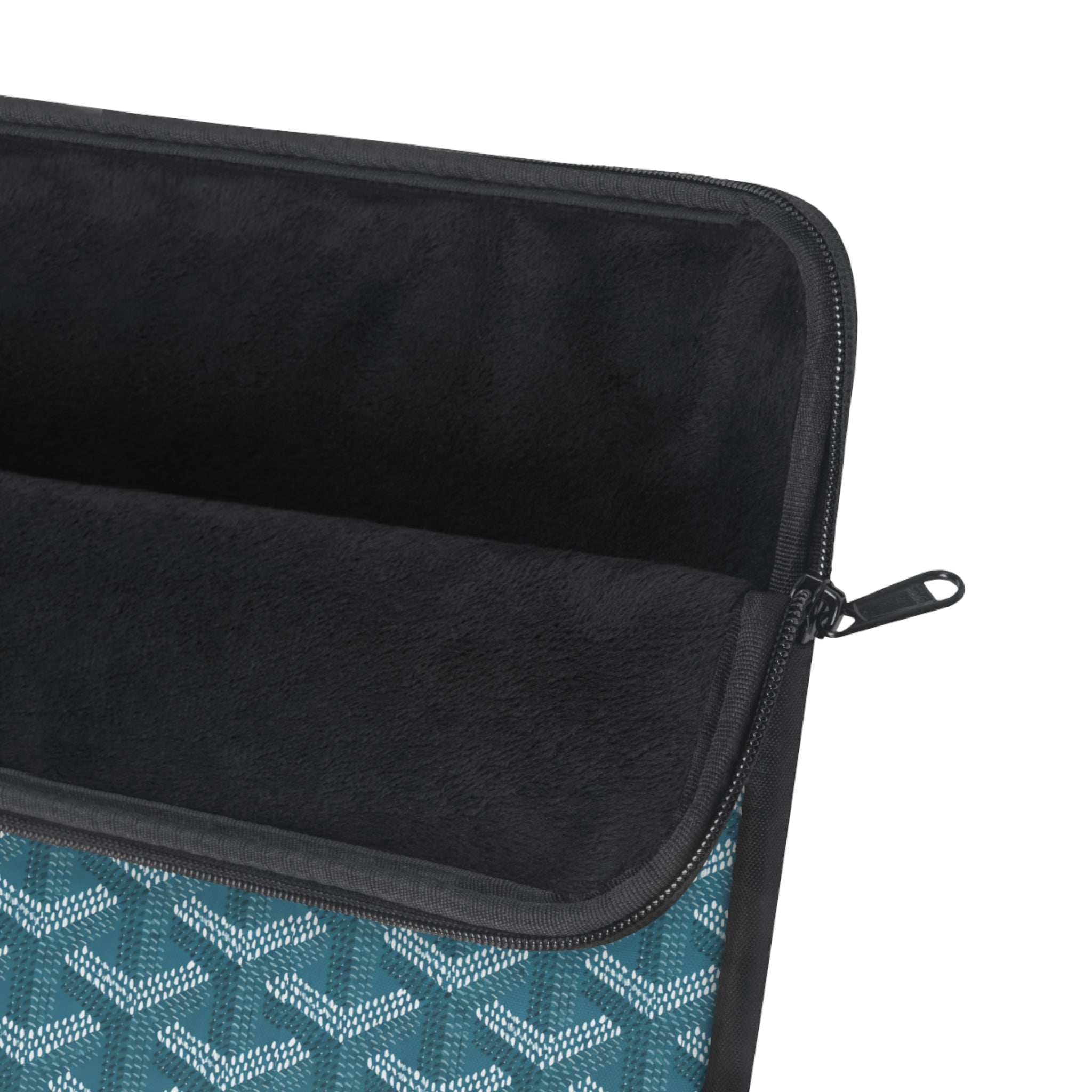 Black interior lining of teal laptop sleeve, showing zip and edge piping