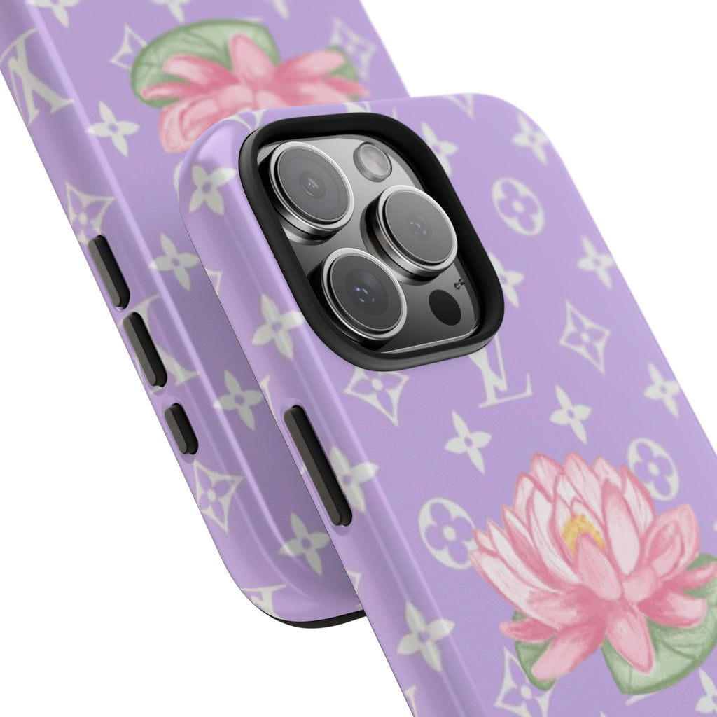 Purple phone case close-up with black camera surround and pink lotus graphic