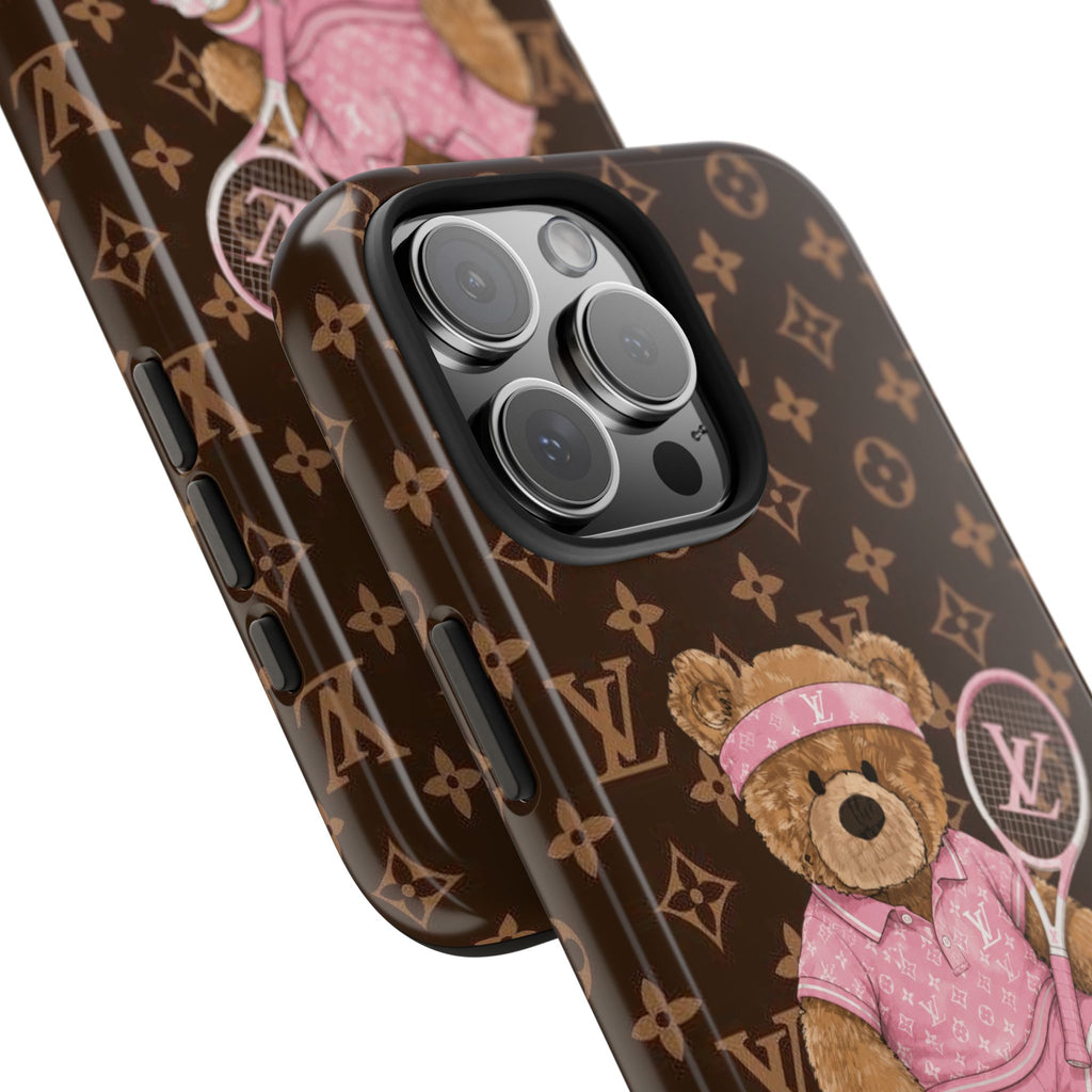 Phone case close-up with LV monogram, pink teddy bear and camera cutout