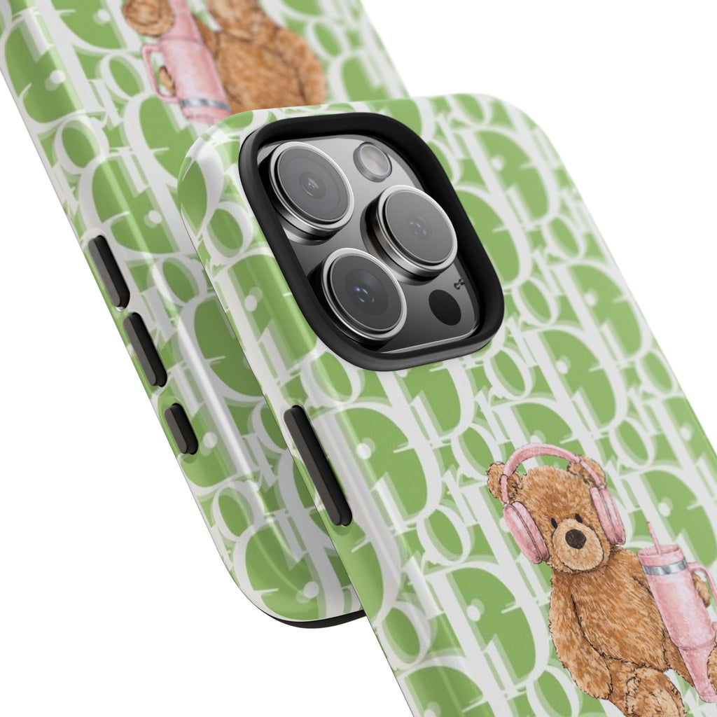 Green phone case angled view with Dior monogram and teddy bear headphone charm