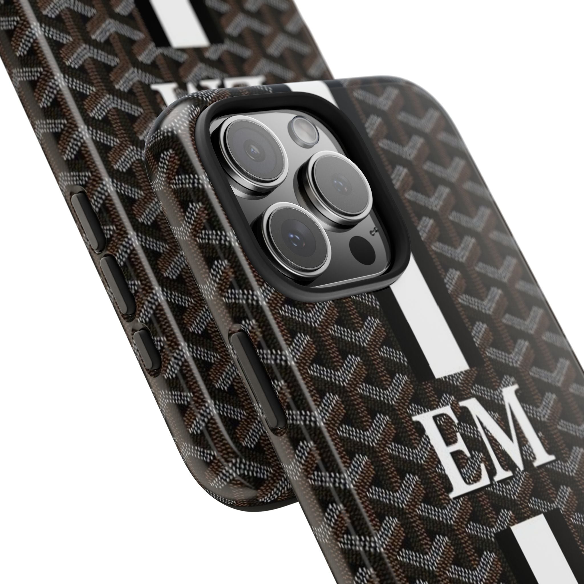 Personalized phone case corner view with dark Goyard-style pattern, white stripe, “EM”