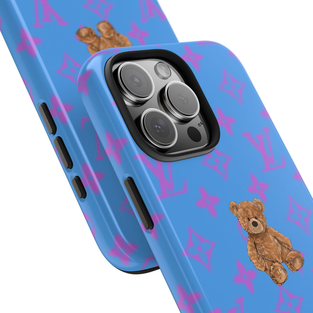 Royal blue phone case with purple logo pattern, teddy bear detail, and side button cutouts