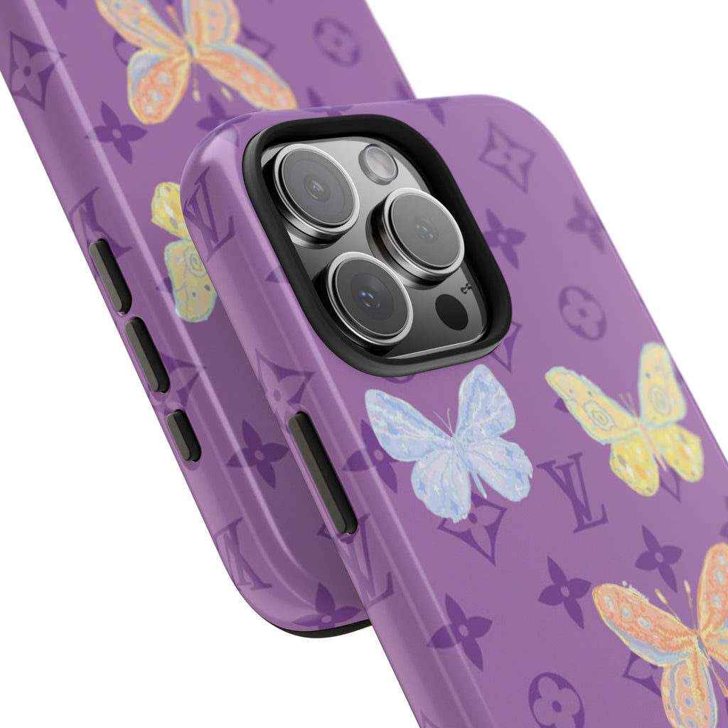 Purple phone case close-up with butterflies, LV-style icons, and camera lens cutouts.