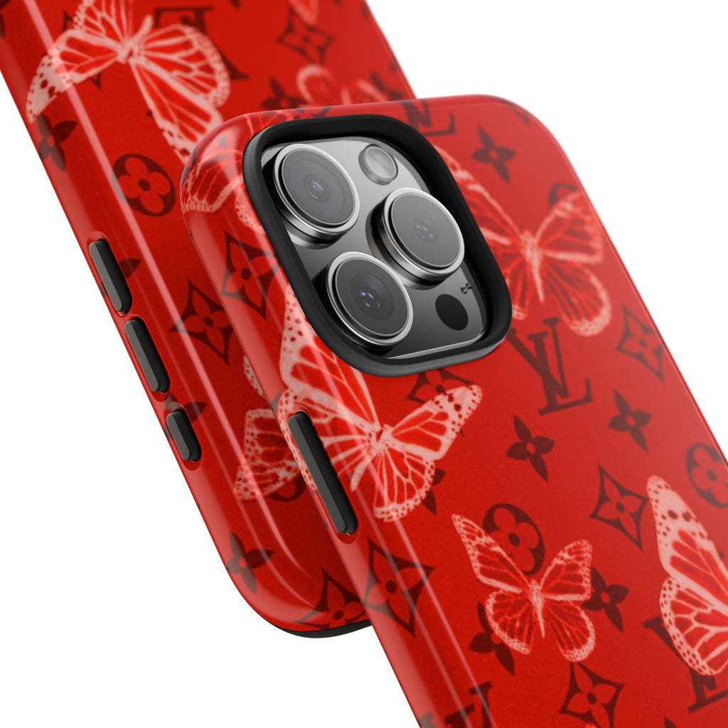 Red phone case close-up showing butterfly print and camera lens cutouts