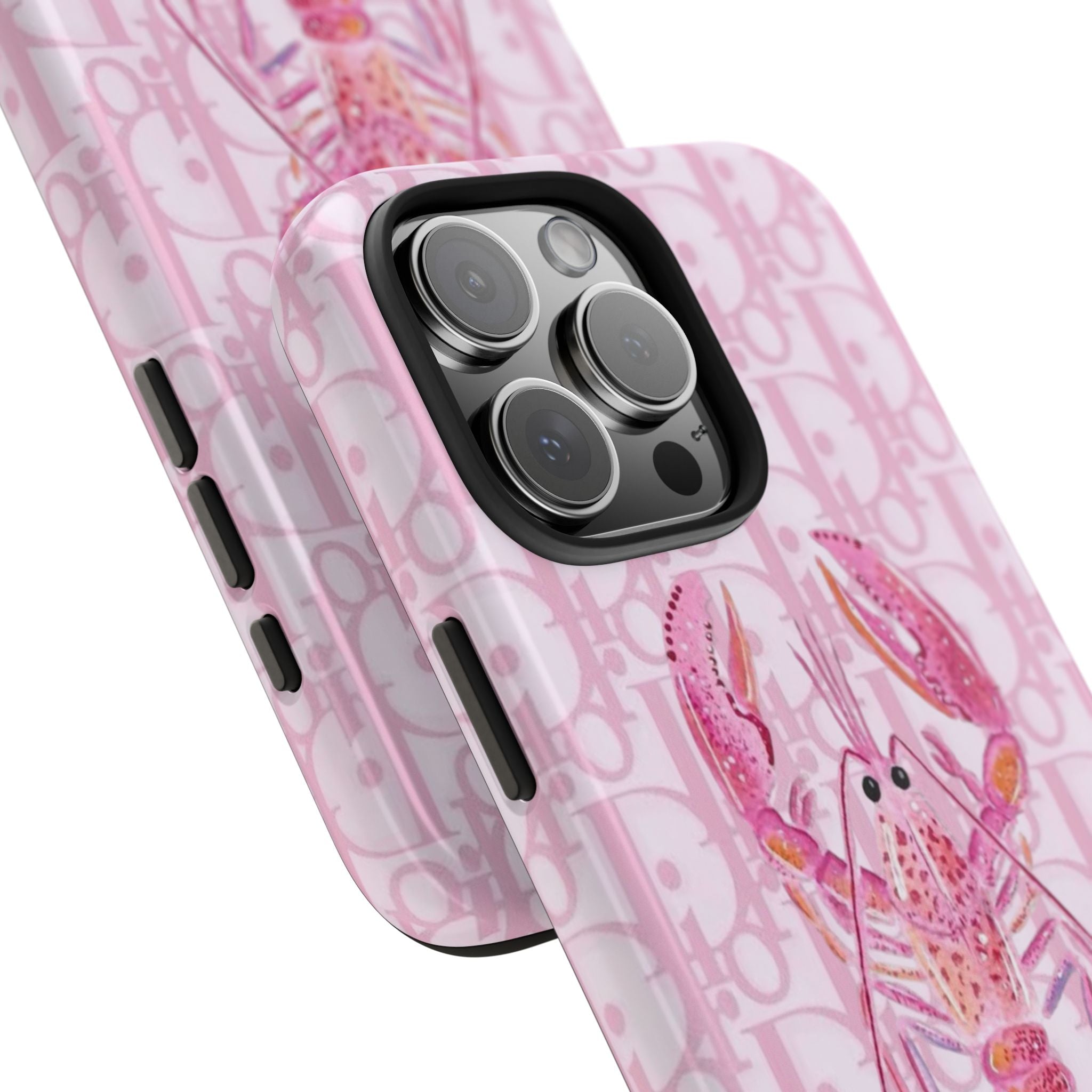Pink Dior phone case close-up with lobster illustration, monogram background, camera lenses
