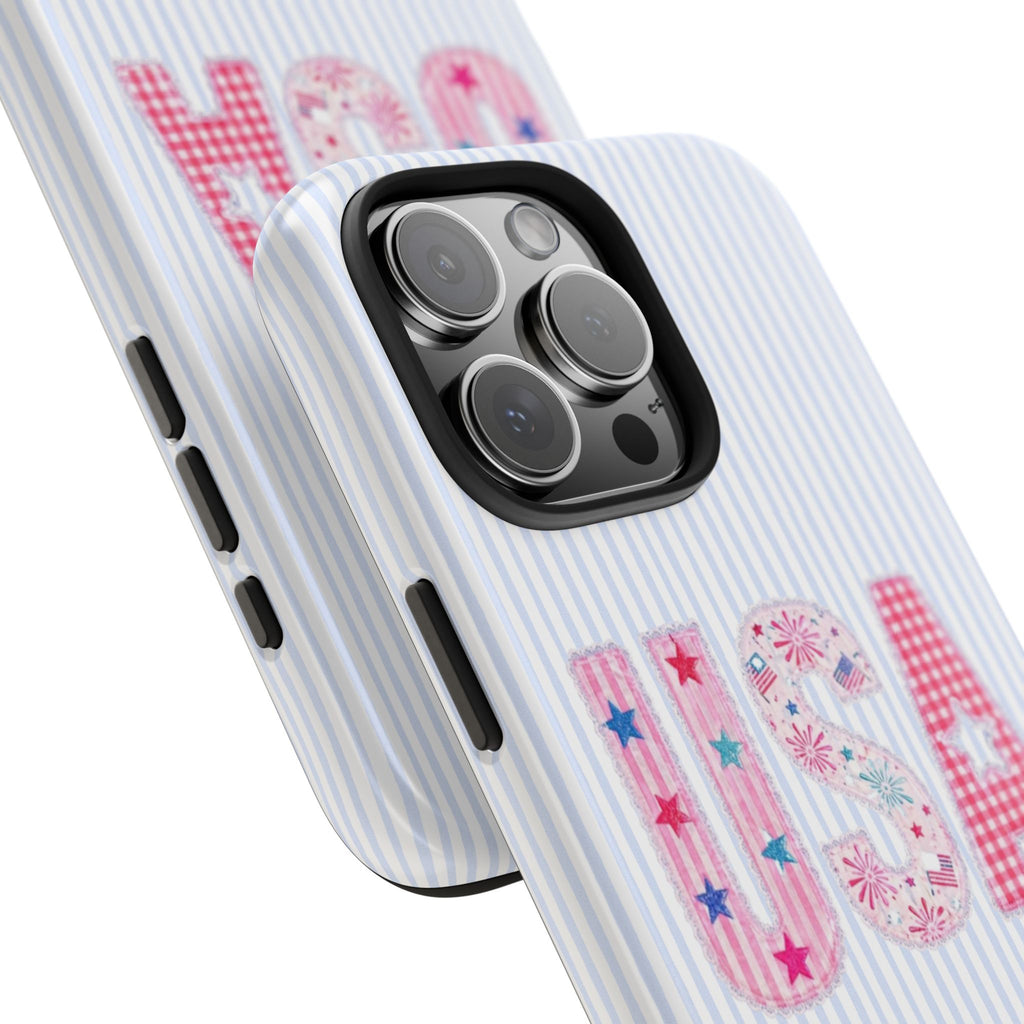 Phone case close-up: light blue striped background with USA letter graphic and camera cutout