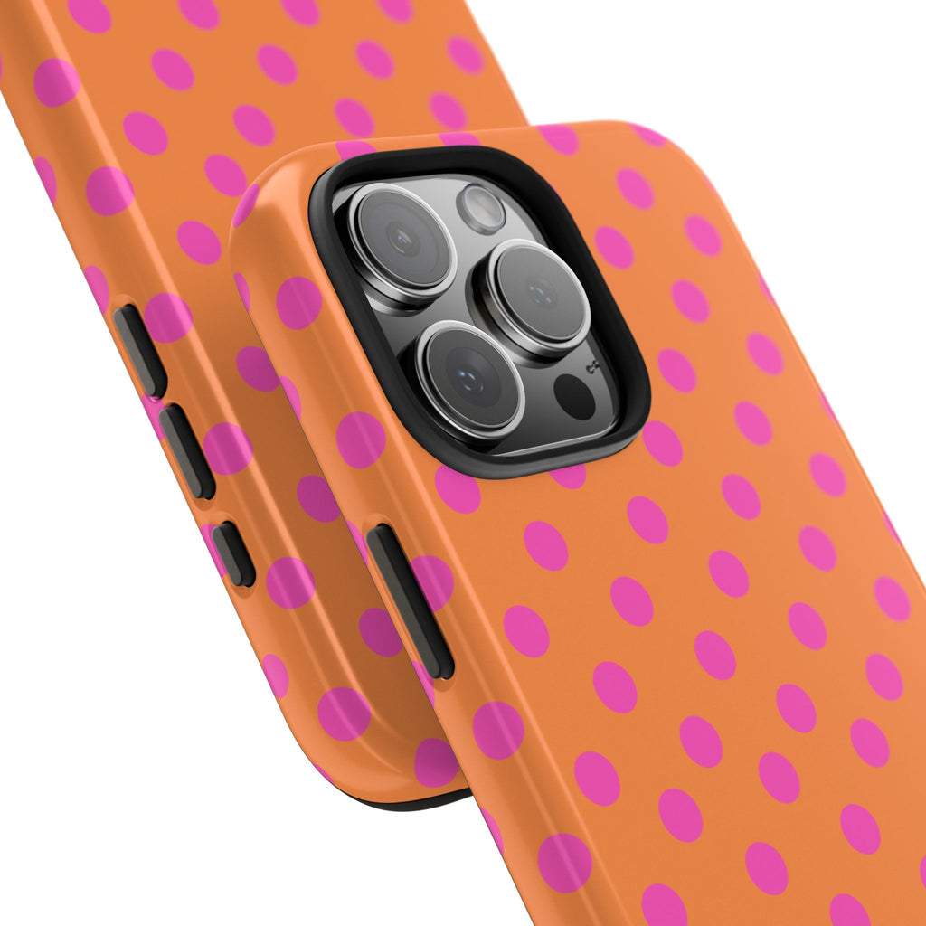 Orange phone case with pink polka dots, showing camera lens openings