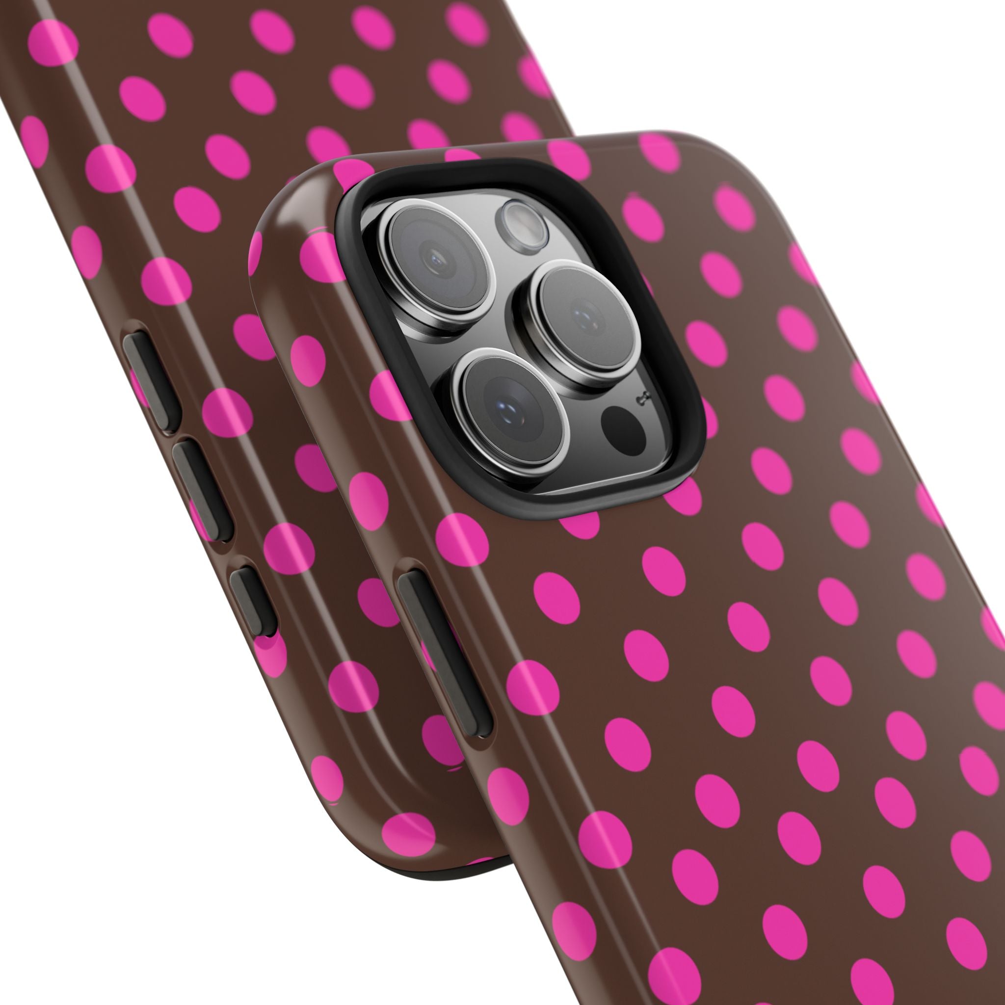 Brown phone case with pink polka dots; close-up of camera lenses and side buttons