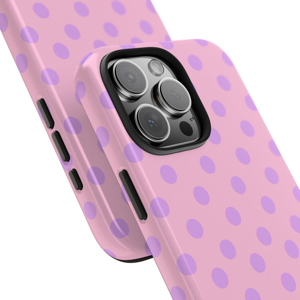 Pink phone case with lavender polka dots, close-up camera cutout and side buttons