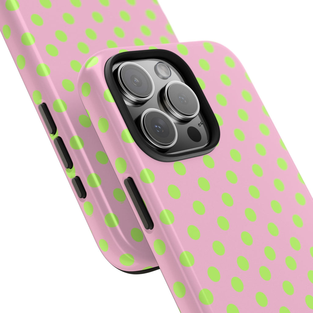 Rose pink phone case with lime green polka dots and side button openings