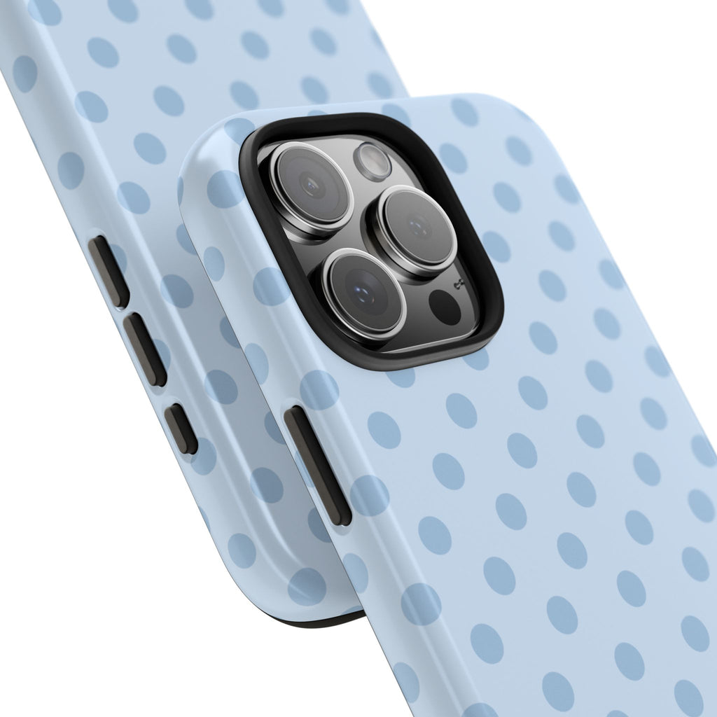 Light blue polka dot phone case with triple-camera cutout and side button slots.