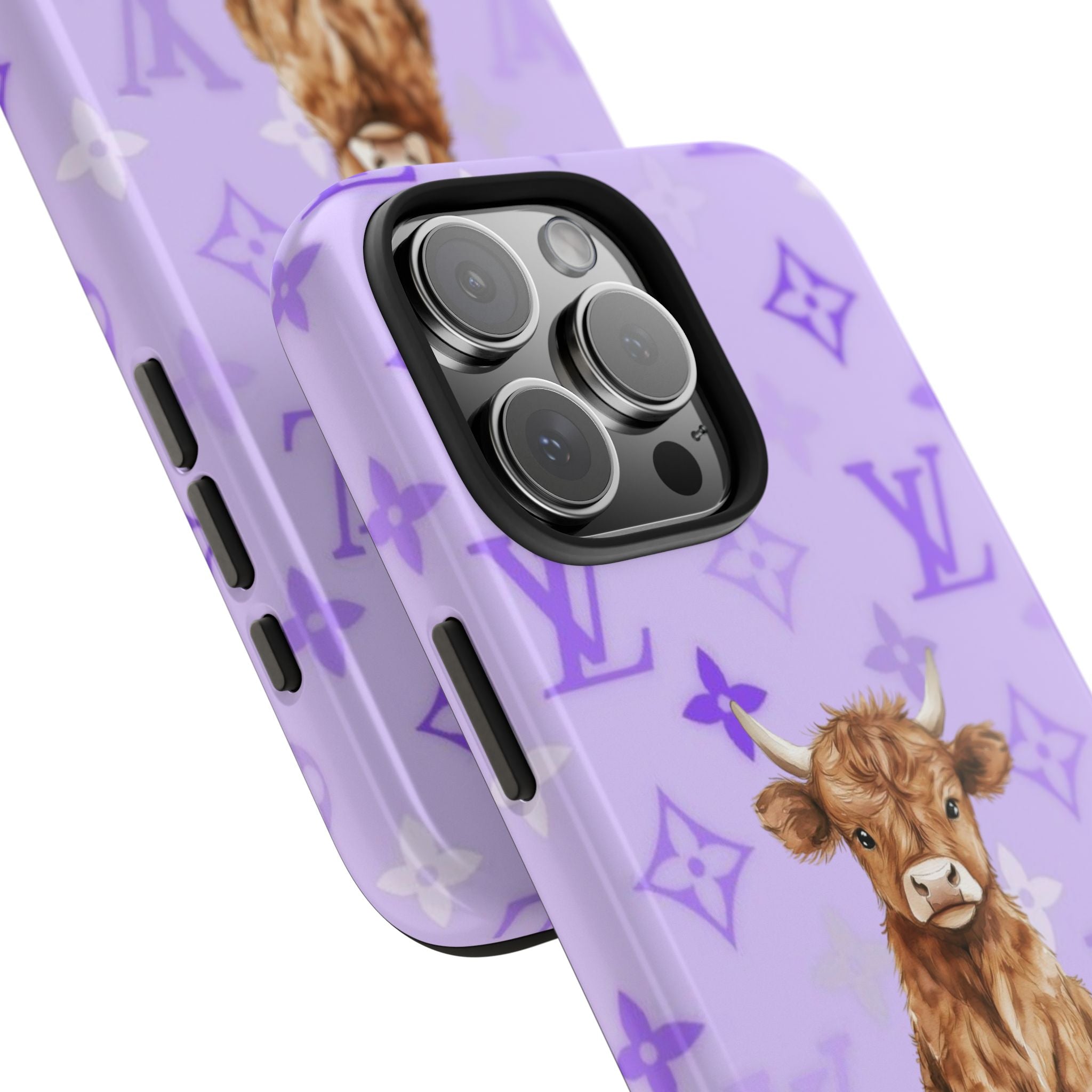 Lavender phone case close-up with Highland cow and purple monogram pattern near camera lenses