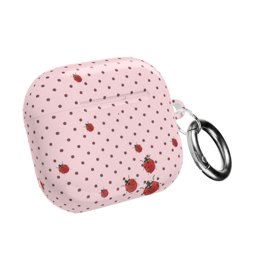 Pink polka dot AirPods case with ladybug print and metal key ring on side