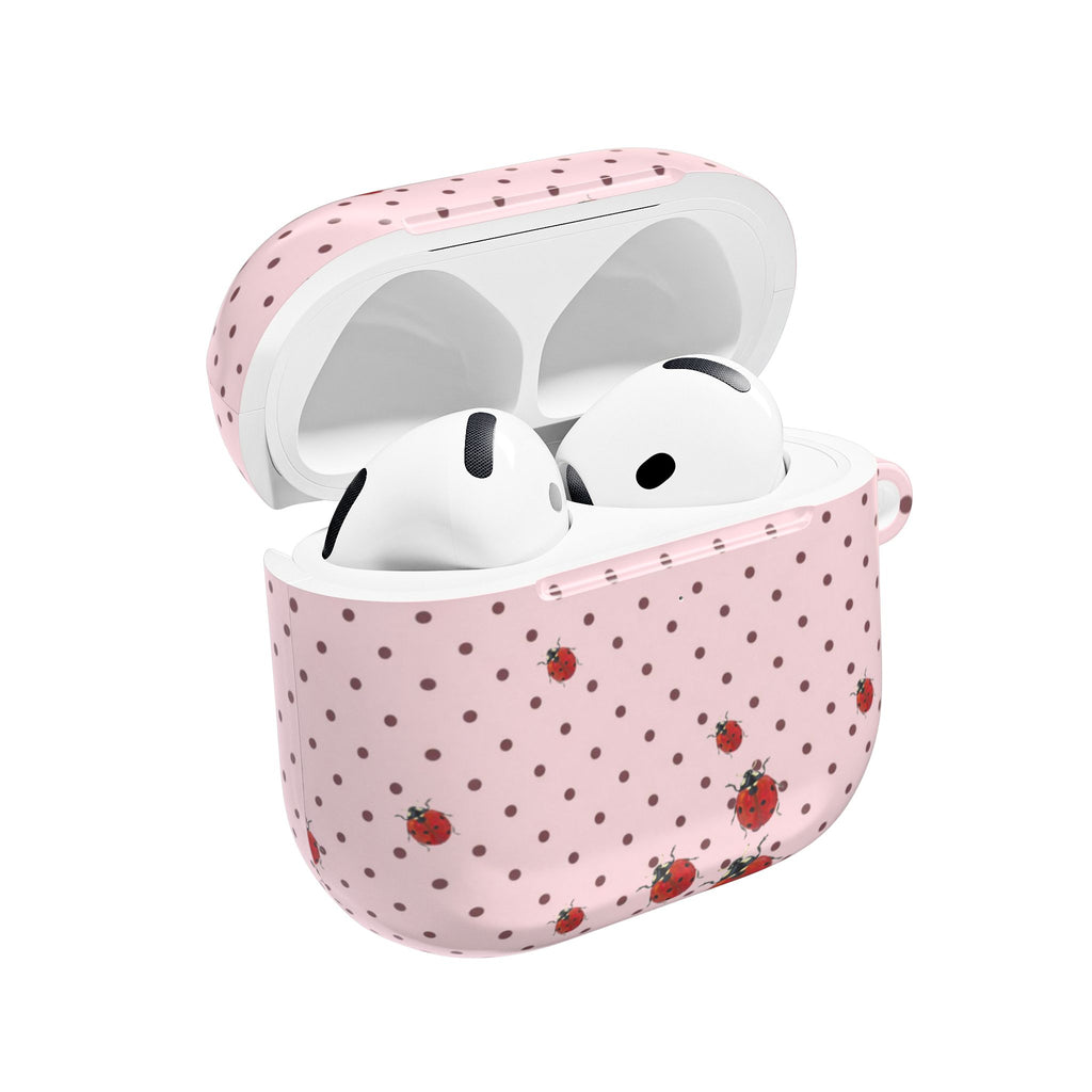 Pink polka dot AirPods case with ladybug print, open view showing earbuds inside