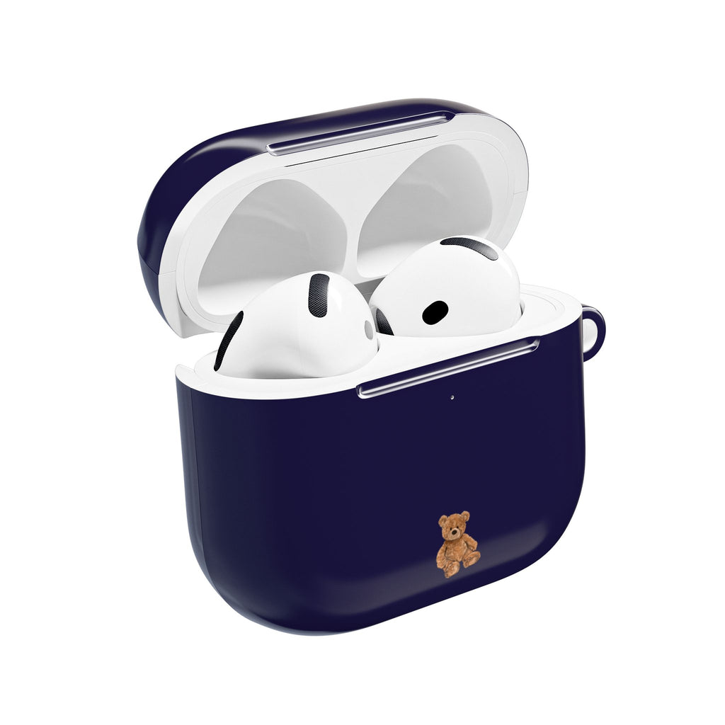 Navy mini AirPod case with teddy bear charm on front, lid open for earbuds