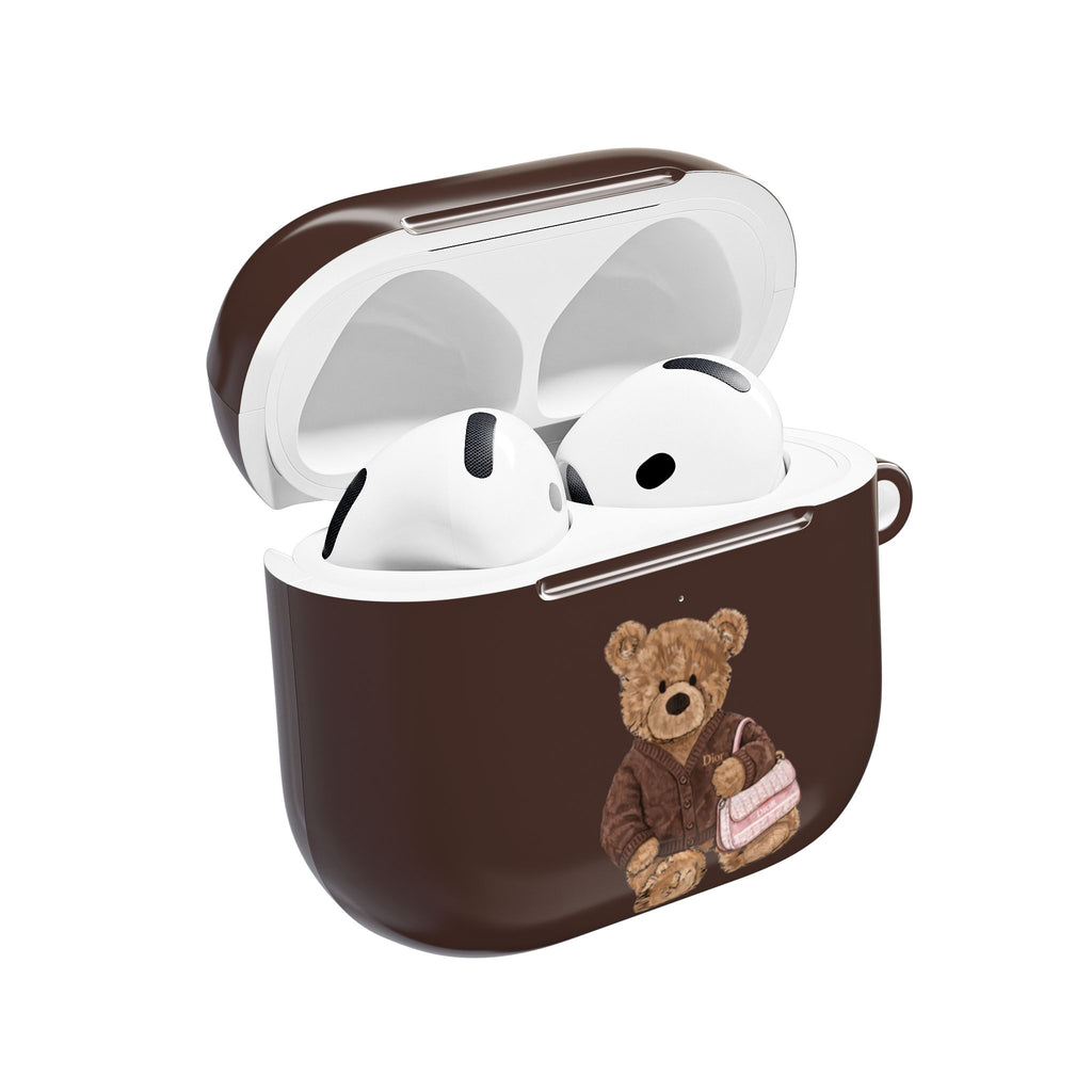 Brown AirPods case with teddy bear appliqué, Dior branding, open lid