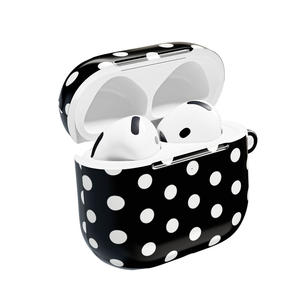 AirPods case with open top, white earbuds in a black polka dot shell