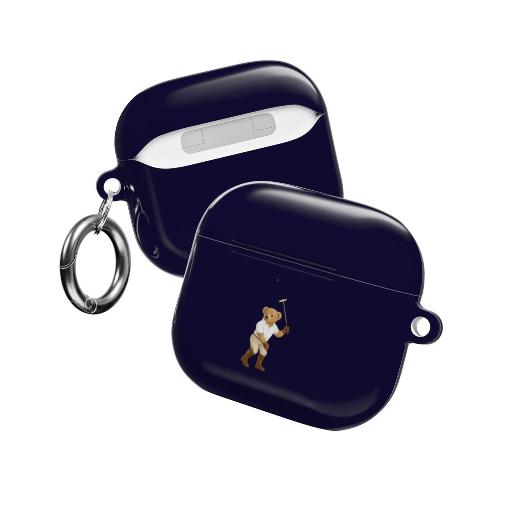 Navy blue AirPods case with teddy bear graphic and metal key ring, angled view