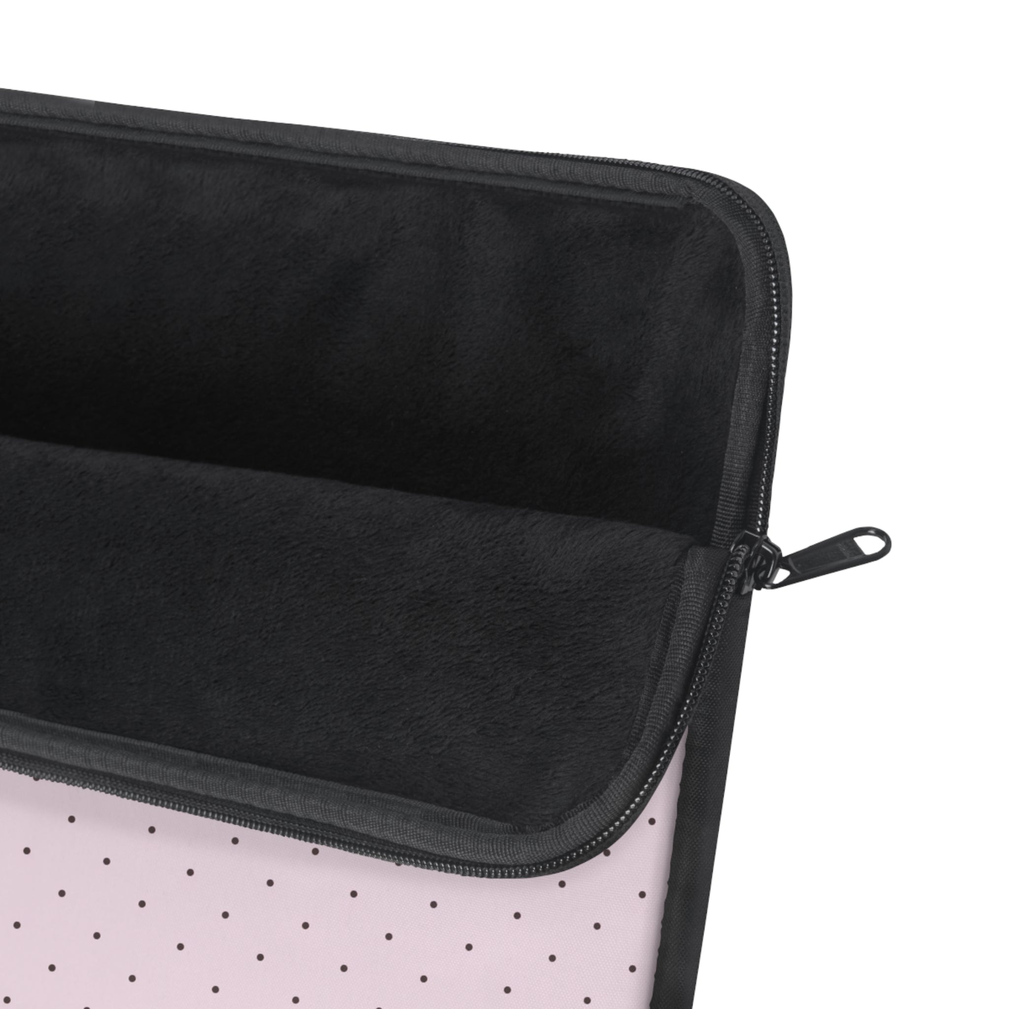 Black-lined zippered sleeve with pink polka dot exterior