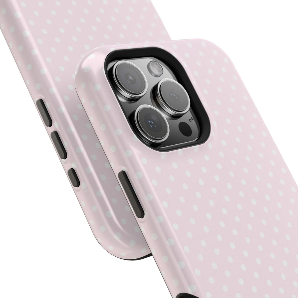 Pink polka dot phone case close-up with side buttons and camera cutout visible