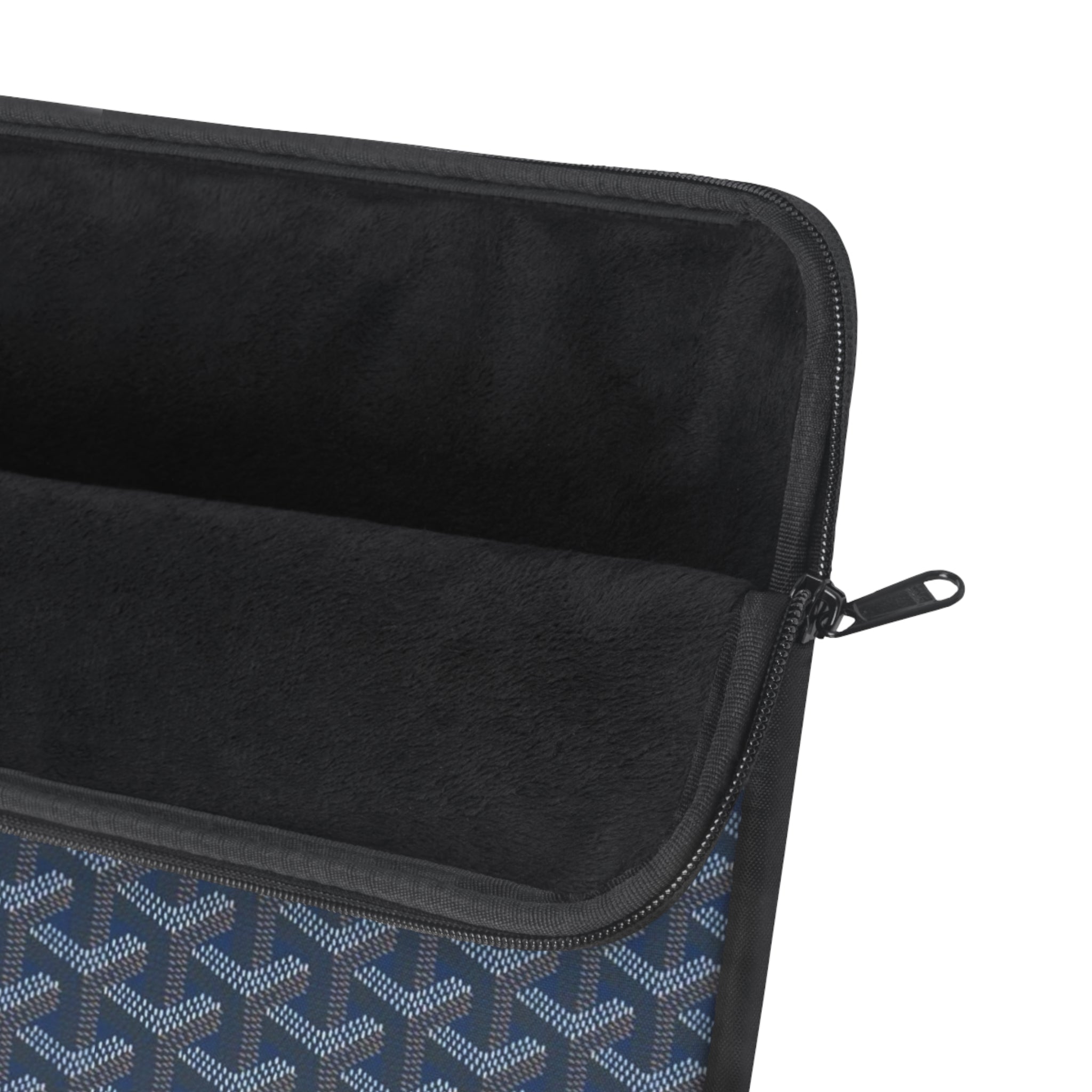 Blue patterned sleeve with black interior lining and zipper with metal pull tab