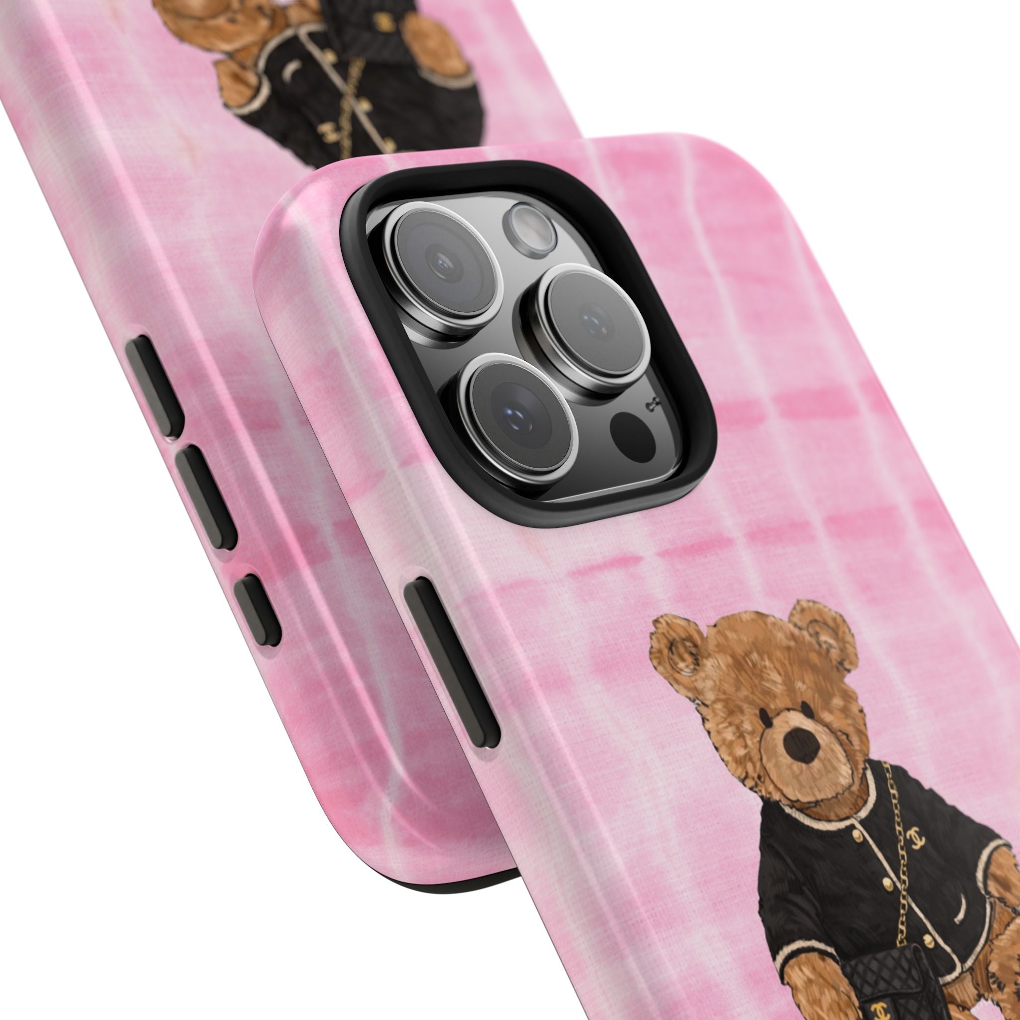 Pink shibori phone case with teddy bear artwork near camera lens cutouts
