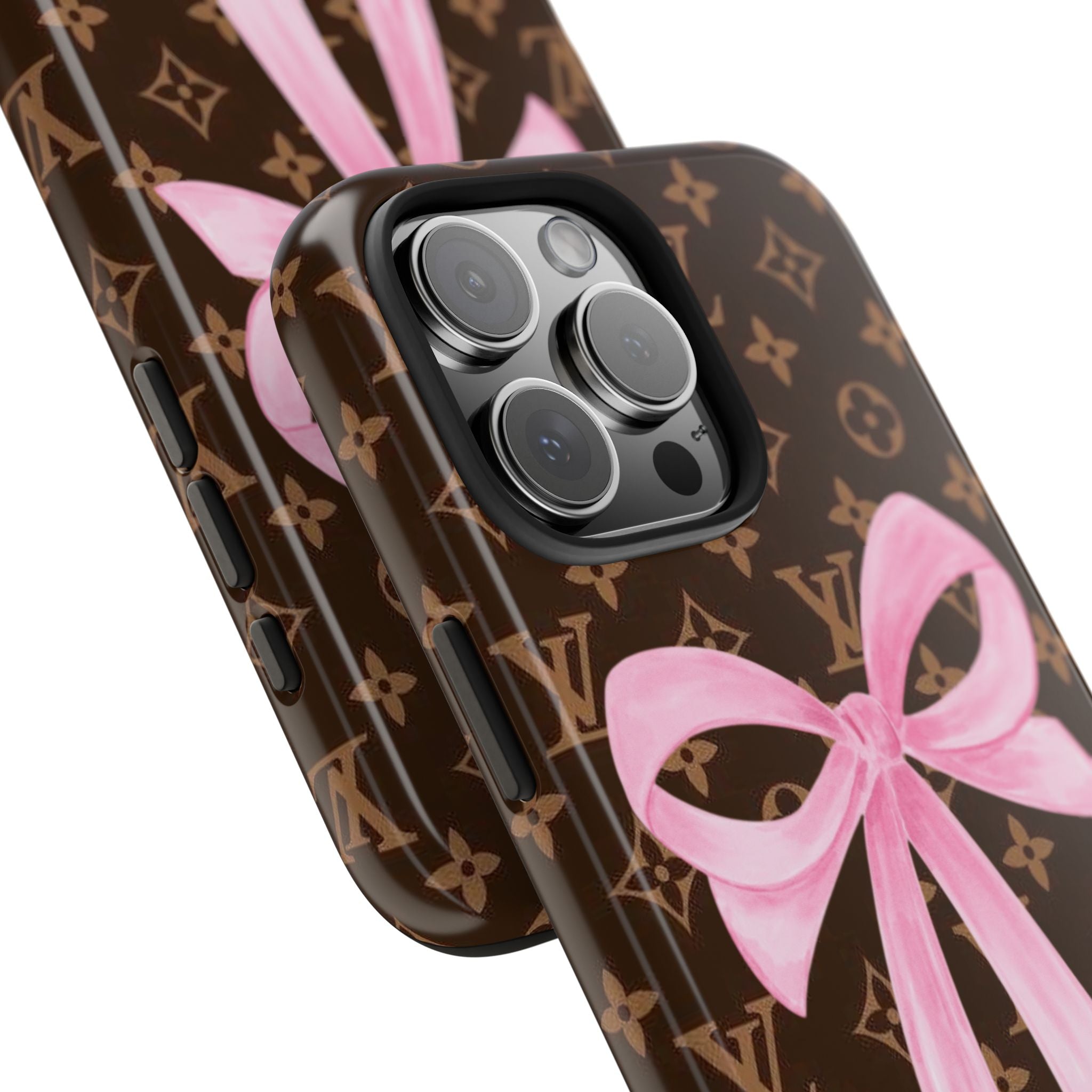 LV monogram phone case with pink bow, angled view of camera area and side buttons
