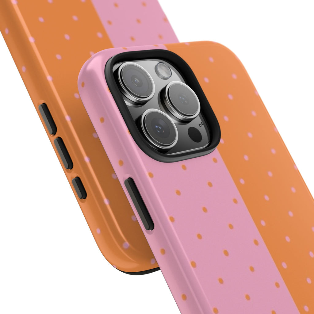 Angled phone case with pink and orange polka dots, camera cover and side buttons