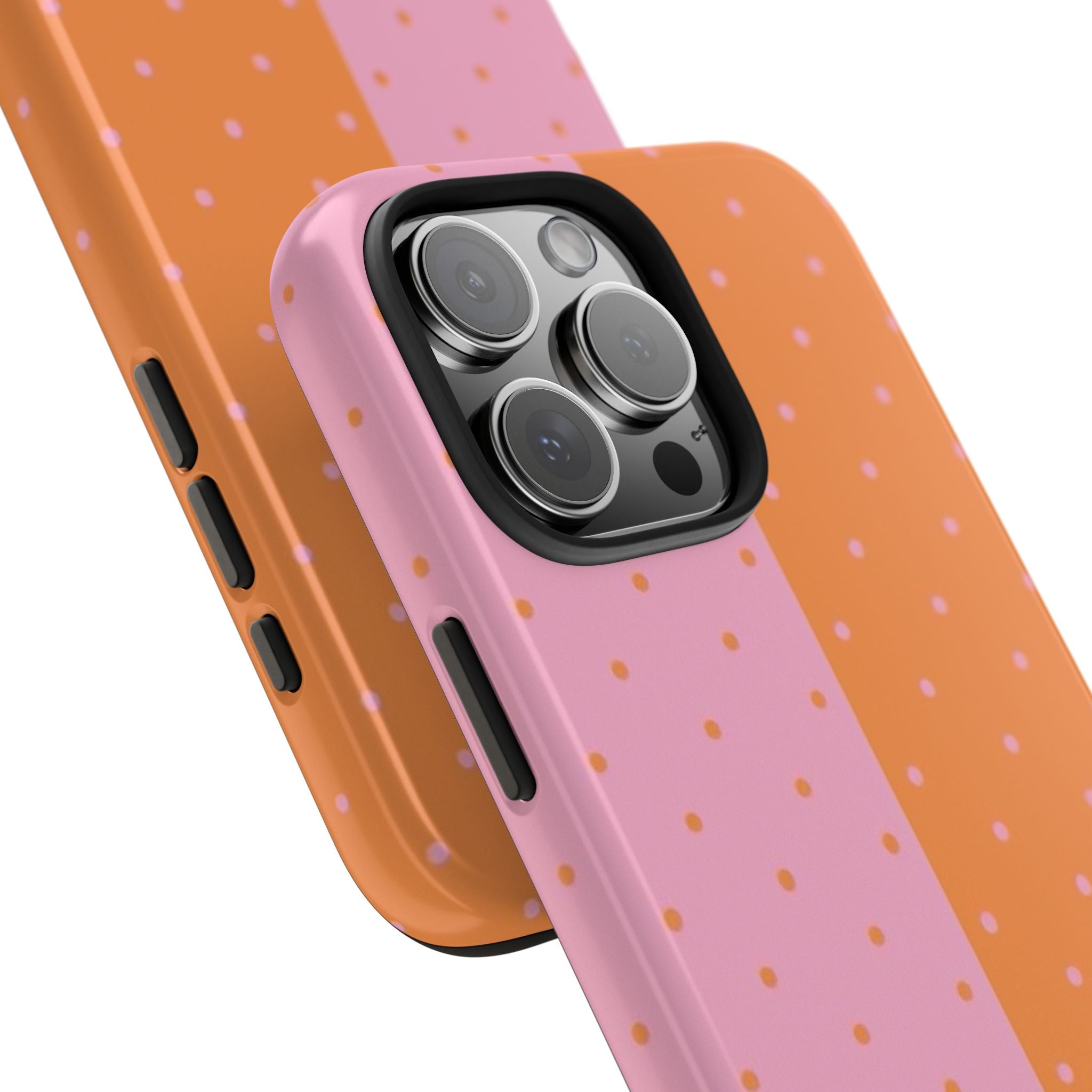 Angled phone case with pink and orange polka dots, camera cover and side buttons
