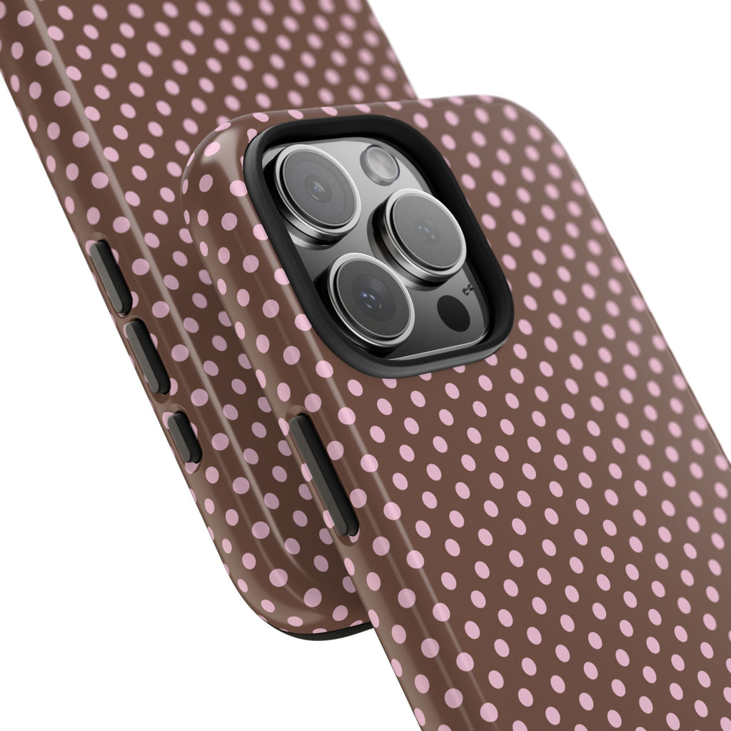Mocha-brown polka dot phone case close-up, raised camera lens area and side buttons