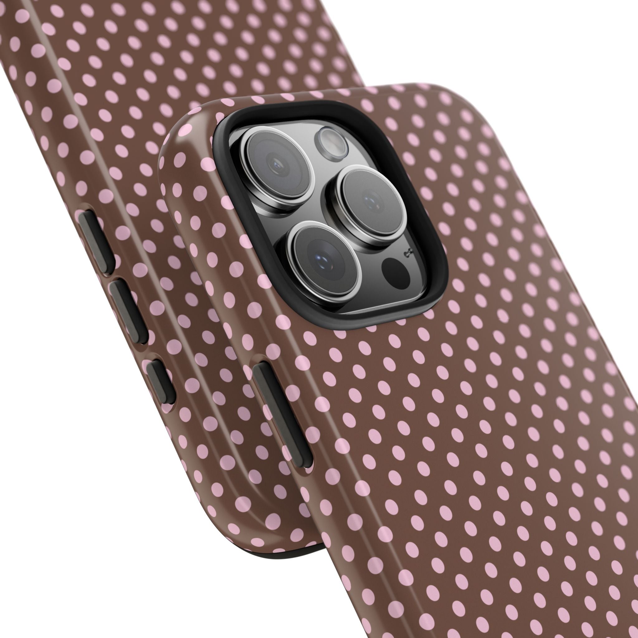 Mocha-brown polka dot phone case close-up, raised camera lens area and side buttons