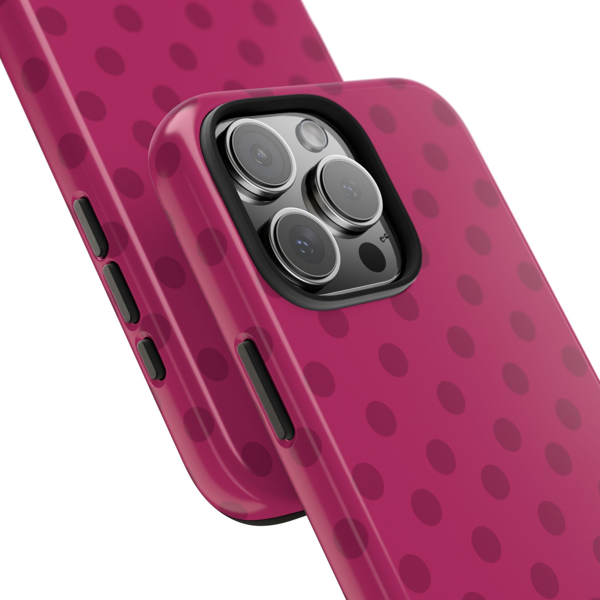 Cranberry pink phone case with dark polka dots; close view of triple camera and side cutouts