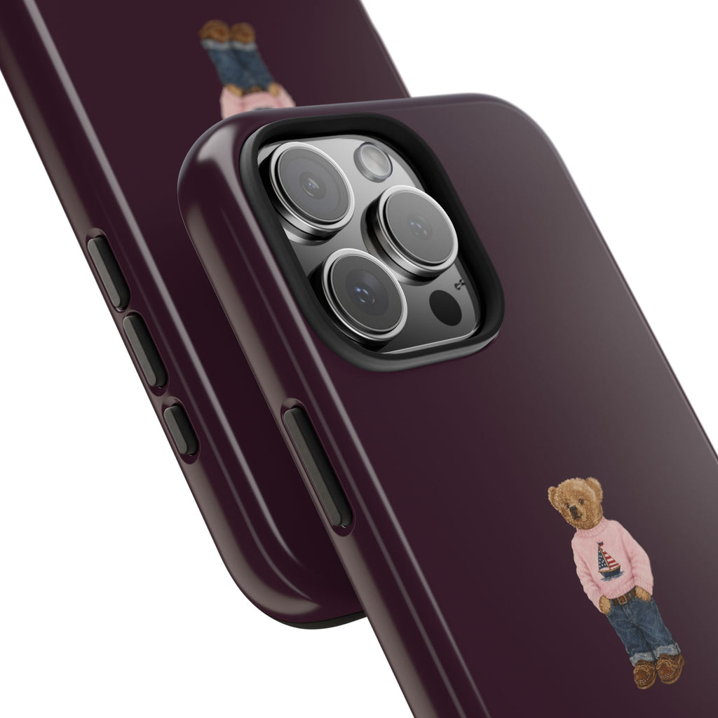 Burgundy teddy bear sailor phone case close-up showing camera cutout and bear