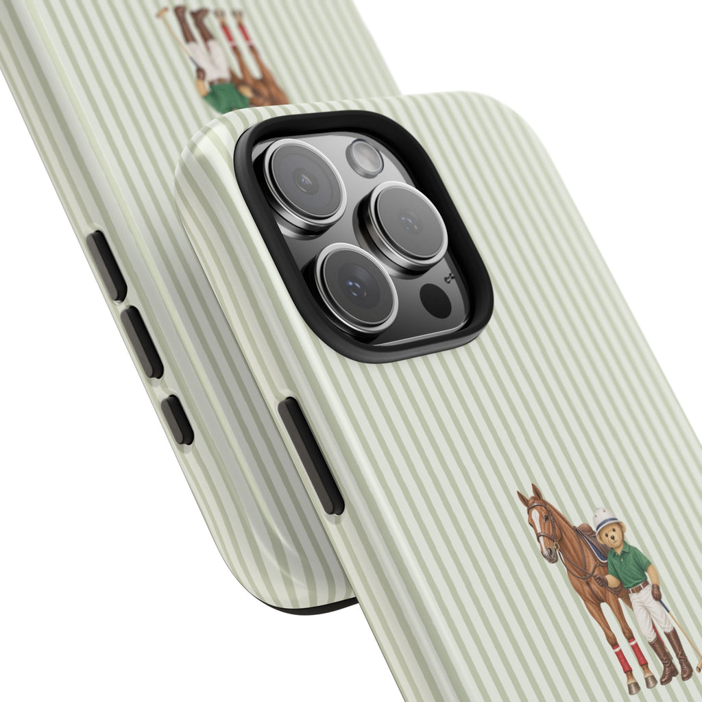 Green striped phone case with horse and teddy bear; angled view of camera cutouts