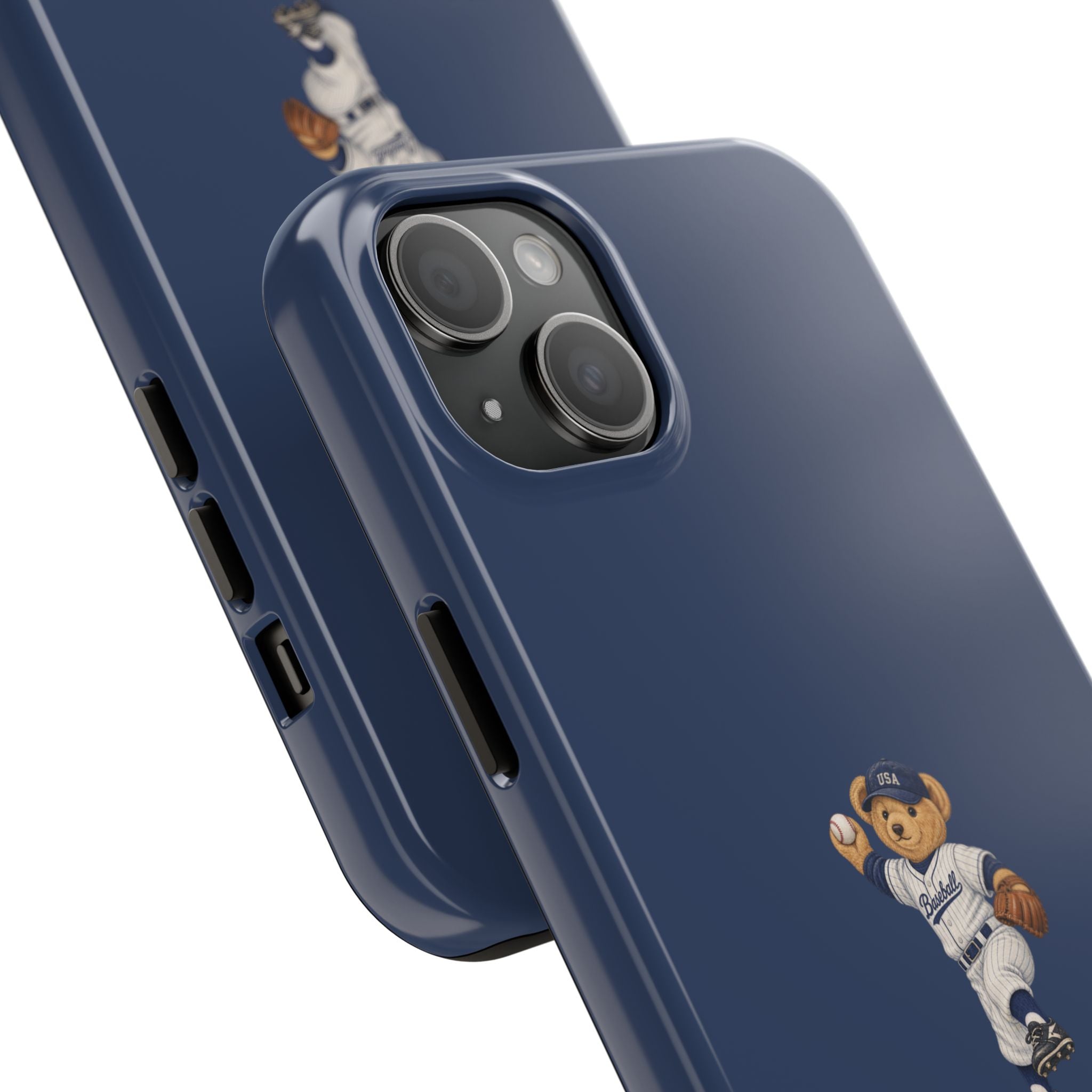 Navy blue phone case close-up, showing camera lenses and teddy bear baseball graphic