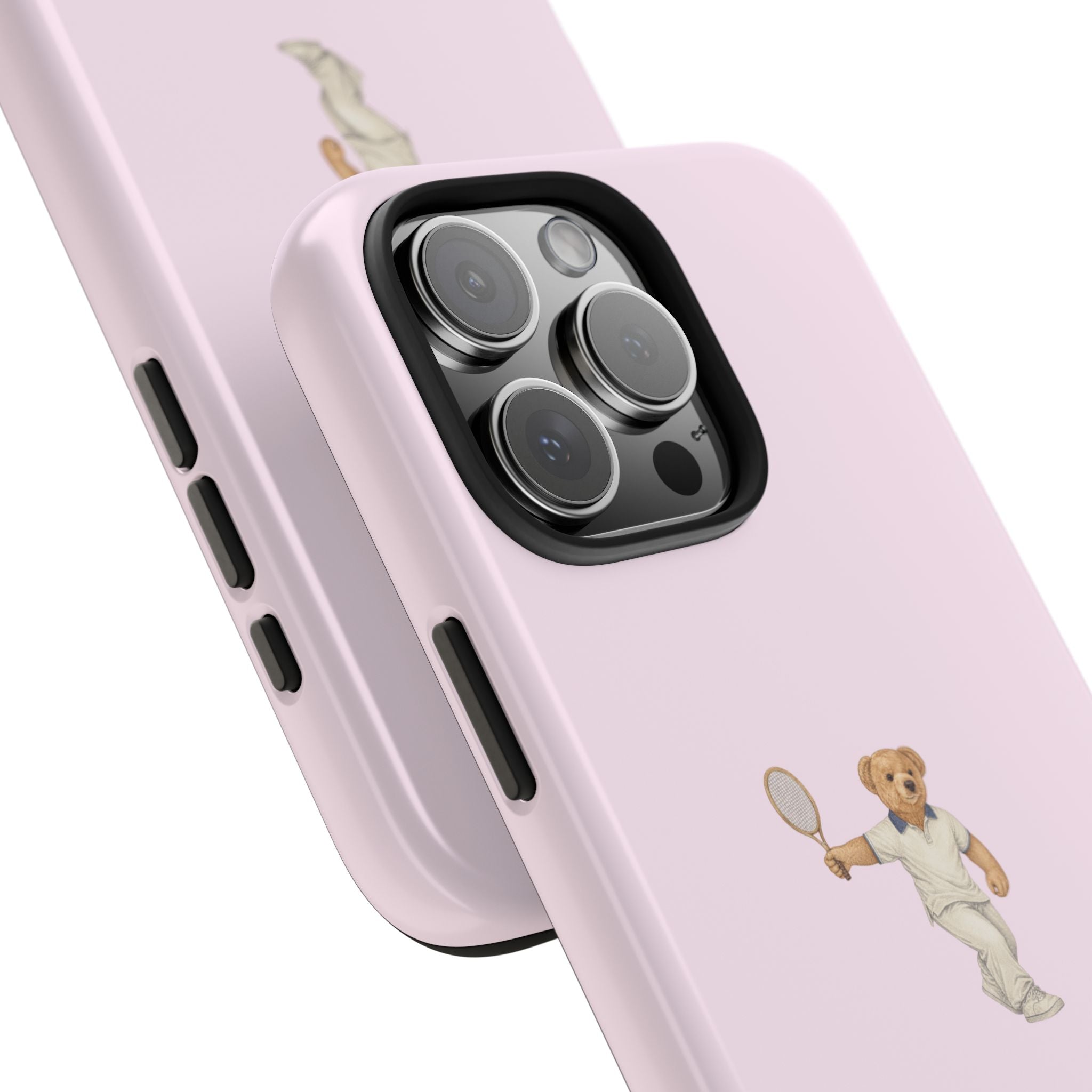 Pink phone case close-up with tennis teddy bear figure and triple camera